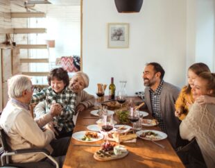Family gathered around holiday dinner table